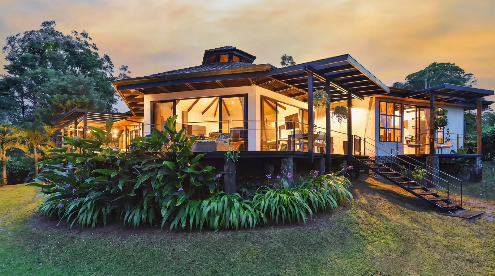 Arenal Kabata Luxury Home exterior at sunset