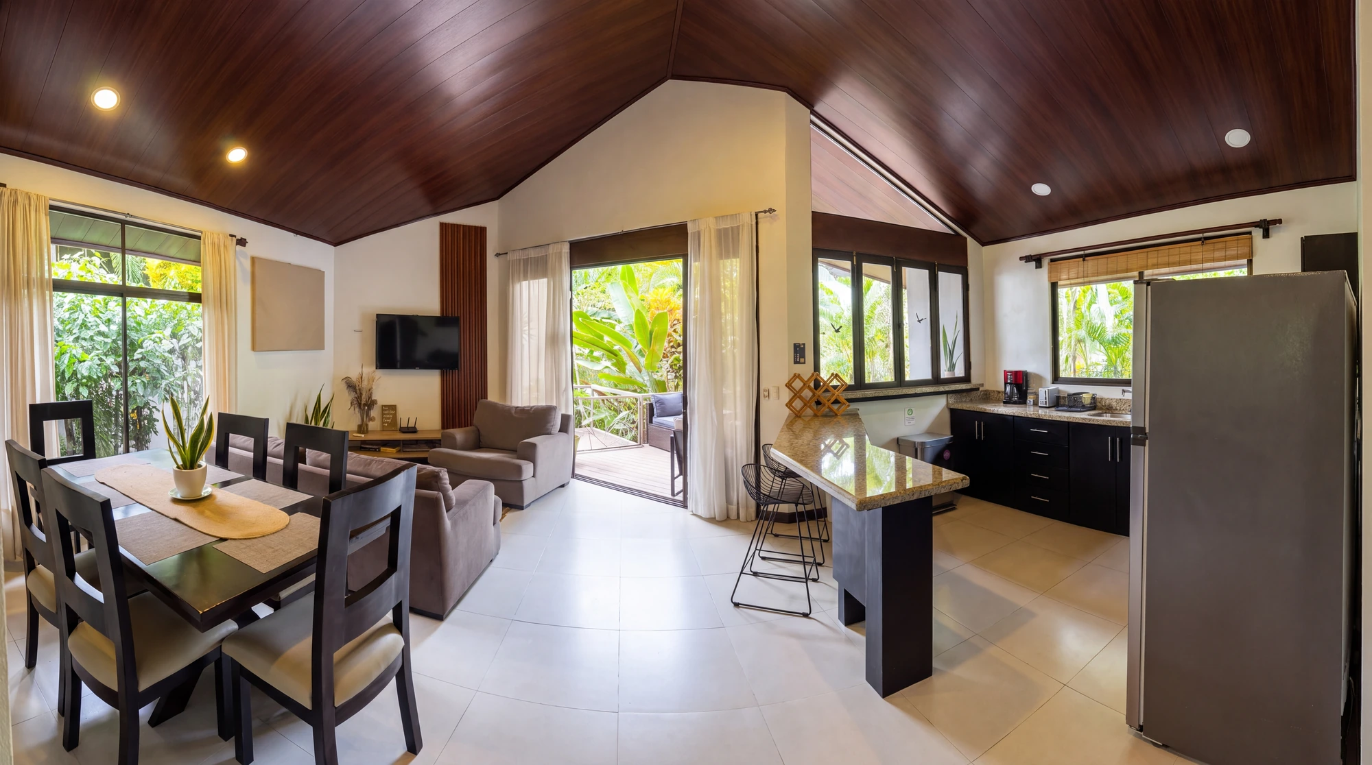 Hummingbird Home panoramic living, dining and kitchen